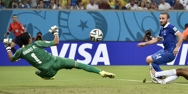 Costa Rica's goalkeeper Keylor Navas saves a shot by Greece's Dimitris Salpingidis. Photo / AP