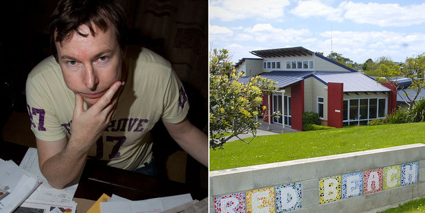 Jeff McClintock with some of the correspondence he's had with his daughter's school, Red Beach, over the years over its Bible classes. Photo / NZ Herald