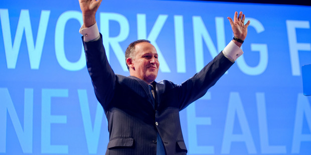 Prime Minister John Key waves to supporters after his pre-election speech to the National Party conference. Photo / Mark Mitchell