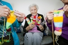 SPINNING YARNS: Betty Cottle and her friends have knitted hundreds of colourful dolls for children staying in Tauranga Hospital.PHOTO/ANDREW WARNER SPINNING YARNS: Betty Cottle and her friends have knitted hundreds of colourful dolls for children staying in Tauranga Hospital.PHOTO/ANDREW WARNER