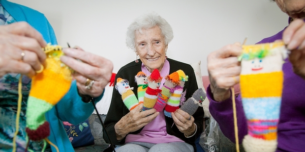 SPINNING YARNS: Betty Cottle and her friends have knitted hundreds of colourful dolls for children staying in Tauranga Hospital.PHOTO/ANDREW WARNER