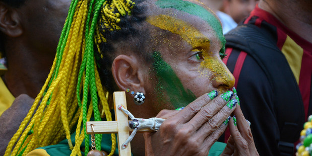 A Brazilian football fan watches a game anxiously. Photo / Creative Commons image by Flickr user Ben Tavener