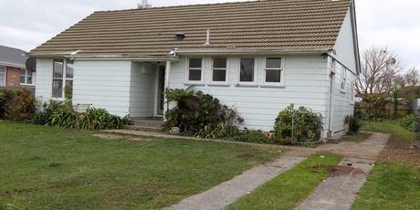 The house after truckloads of trash were removed. Photo / Duncan Brown