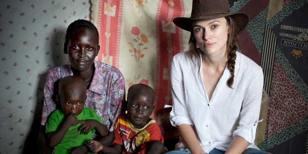 British actress Keira Knightley meets local widow Rebecca Karkwasni, who was reunited with her children at the camp. Photo / Panos