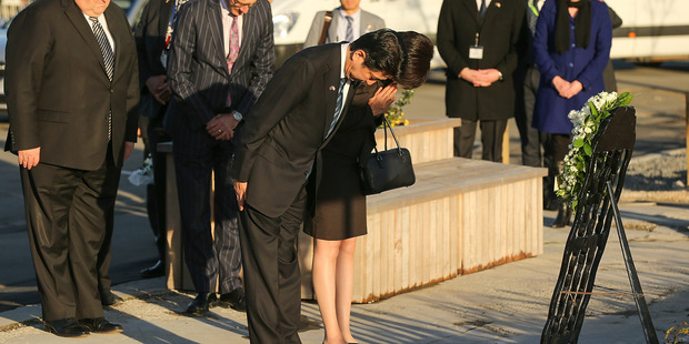 Japanese Prime Minister Shinzo Abe and his wife Akie Abe lay a wreath at the CTV site. Photo / Getty Images