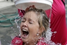 Natasha Brocklebank endures a bucket of icy water at the Guthrie Park Football club, Havelock North, yesterday. Photo / Paul Taylor Natasha Brocklebank endures a bucket of icy water at the Guthrie Park Football club, Havelock North, yesterday. Photo / Paul Taylor