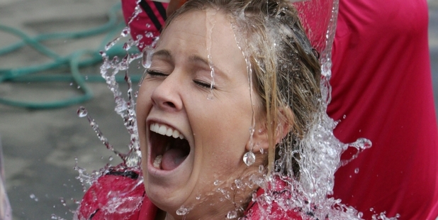Natasha Brocklebank endures a bucket of icy water at the Guthrie Park Football club, Havelock North, yesterday. Photo / Paul Taylor