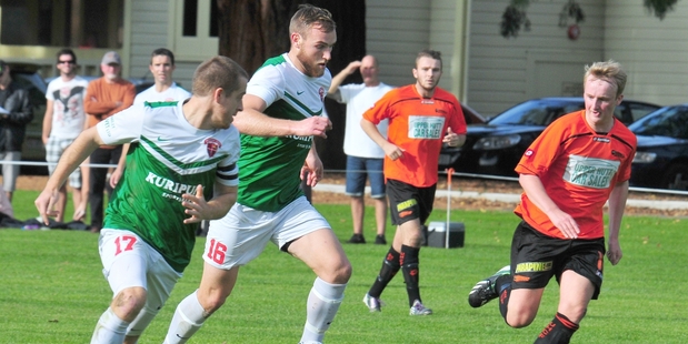PROLIFIC STRIKER: Hamish Watson on the ball for Wairarapa United with Nick Roydhouse in support.PHOTOS/FILE