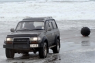 After being declared non-explosive, the mine was towed up the beach and taken to the police station. Photo / Tania Newman After being declared non-explosive, the mine was towed up the beach and taken to the police station. Photo / Tania Newman