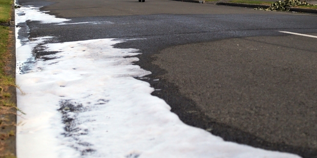 INVESTIGATION: Foam is used to clean up the scene of yesterday's fatal crash in Hood St. Photo/Stuart Munro