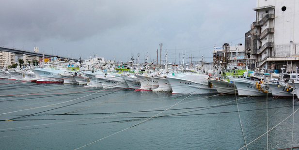 Fishing boats are tied with ropes at Tomari fishing port in Naha, southern Japan islands of Okinawa. Photo / AP