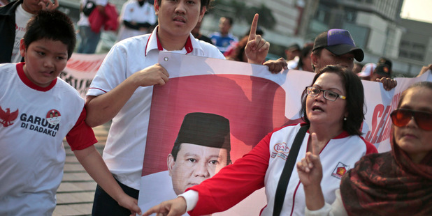Supporters of Indonesian presidential candidate Prabowo Subianto display a banner during a rally in Jakarta, Indonesia. Photo / AP