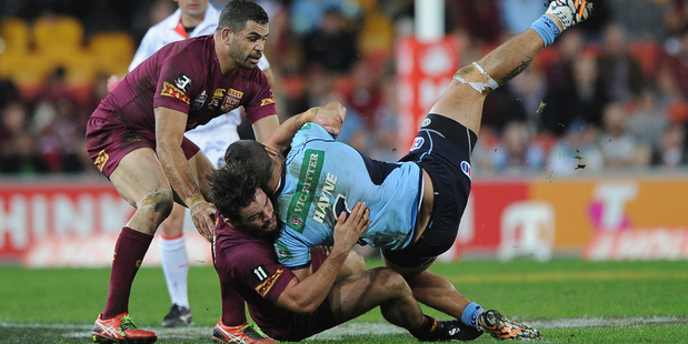Aidan Guerra tackles Jarryd Hayne. Photo / Getty Images