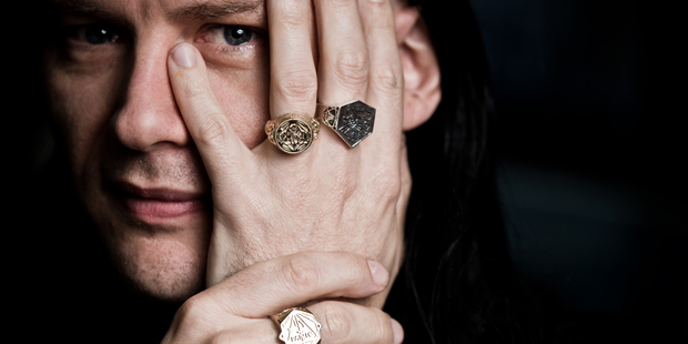 Artist Andrew McLeod wearing his collection of rings made with Meadowlark. Picture / Babiche Martens