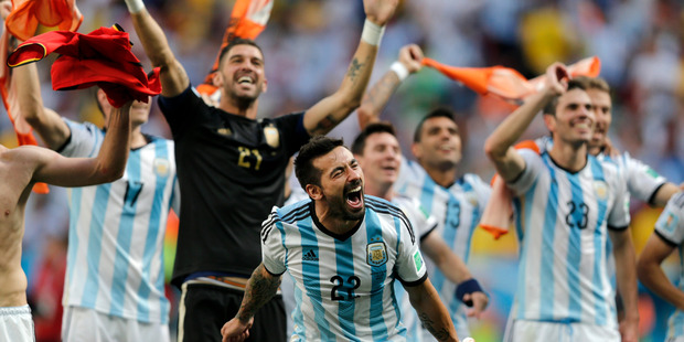 Argentina's Ezequiel Lavezzi and teammates celebrate at the end of the World Cup quarterfinal soccer match between Argentina and Belgium at the Estadio Nacional in Brasil. Photo / AP.