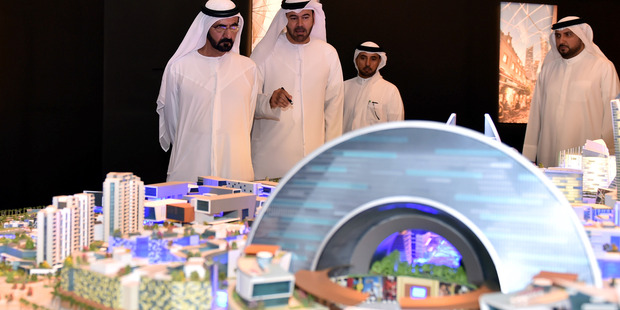 UAE Prime Minister and Dubai ruler Sheik Mohammed bin Rashid Al Maktoum looks at plans for the 'Mall of the World'. AP Photo / Dubai Holding