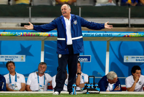 Brazil's coach Luiz Felipe Scolari spreads his arms as he watches the World Cup semifinal soccer match between Brazil and Germany at the Mineirao Stadium. Photo / AP