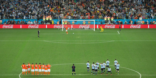 Netherlands' Ron Vlaar reacts after missing a penalty kick in a shootout at the end of the World Cup semifinal soccer match between the Netherlands and Argentina. Photo / AP.