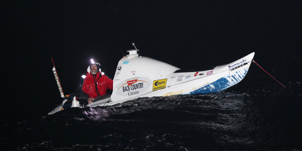 Scott Donaldson has rolled three times during the night and is like 'a dice in a cup' as the waves batter his kayak. Photo / Glenn Jeffrey