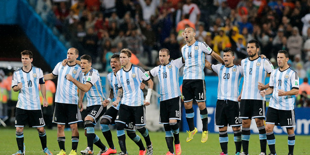 Argentine players react during their penalty shootout win against Netherlands. Photo / AP