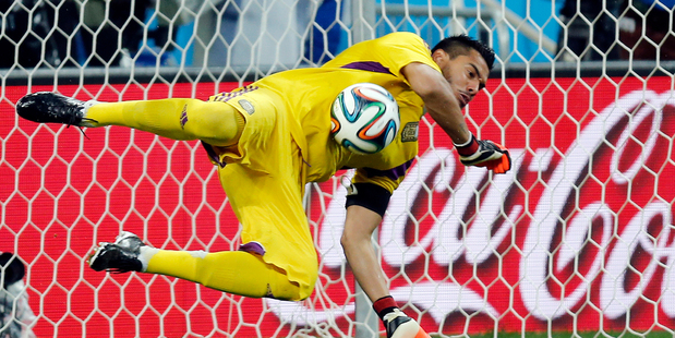 Argentina's goalkeeper Sergio Romero saves a shot from the penalty spot by Netherlands' Ron Vlaar. Photo / AP