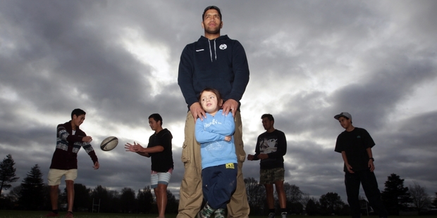 Everard Reid with 4-year-old son Darrell and four of the lads he is mentoring. From left are Kainoa Smith, Te Wheturere Ferris, Kalhain Collier and Kaya Wainohu. Photo/Paul Taylor