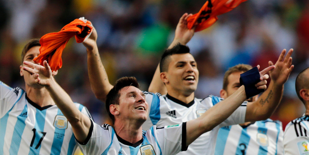 Argentina's Lionel Messi and teammates celebrate at the end of the World Cup quarter-final between Argentina and Belgium. Photo / AP