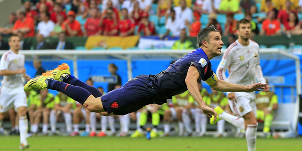 Robin van Persie scores from a diving header against Spain. Photo / AP