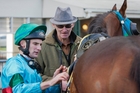 Parkes talks to trainer Richard Sherwin at the winners' parking lot in front of the main grandstand. Parkes talks to trainer Richard Sherwin at the winners' parking lot in front of the main grandstand.