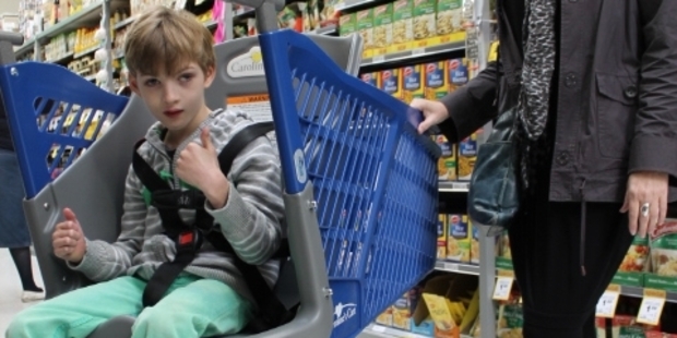 Jo Ellis and her son Harvey, 7, from Waikaraka, taking the new shopping trolley at Countdown Regent for a test drive. Photo/Alyson Eberle