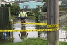 Kawakawa deputy chief fire officer Annette Wynyard wades through floodwaters at a Pembroke St home. Photo/Peter de Graaf Kawakawa deputy chief fire officer Annette Wynyard wades through floodwaters at a Pembroke St home. Photo/Peter de Graaf