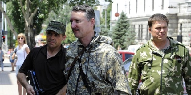 Commander and self-proclaimed minister of Defence Igor Girkin, centre, walks with his bodyguards in the eastern Ukrainian city of Donetsk. Photo / AFP