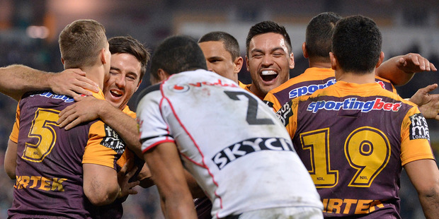Dale Copley (L) of the Broncos celebrates with team mates after scoring a try during the round 19 NRL match between the Brisbane Broncos and the New Zealand Warriors. Photo / Getty Images.