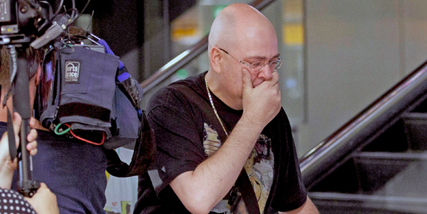 A distraught relative arrives at Schiphol airport in Amsterdam. Photo / AP