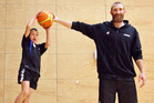 Jackson Beilby, 9, finds stealing the ball from Tall Black Nick Horvath is a tall order during a skills session held at the ASB arena, yesterday. Photo/Andrew Warner Jackson Beilby, 9, finds stealing the ball from Tall Black Nick Horvath is a tall order during a skills session held at the ASB arena, yesterday. Photo/Andrew Warner