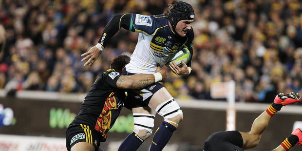 Ben Mowen of the Brumbies is tackled during the Super Rugby Qualifying FInal match between the Brumbies and the Chiefs at GIO Stadium. Photo / Getty Images.