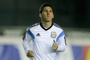 Argentina's Lionel Messi jogs during an official training session at Vasco da Gama Stadium a day before the World Cup soccer final between Germany and Argentina. Photo / AP