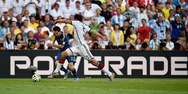 Argentina's Lionel Messi tries to slip past Germany's Mats Hummels. Photo / AP