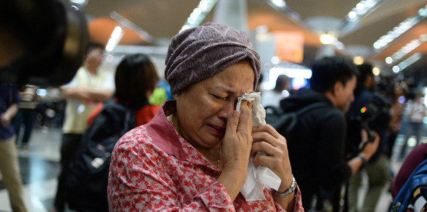 A woman reacts to news regarding a Malaysia Airlines plane that crashed in eastern Ukraine at Kuala Lumpur International Airport in Sepang, Malaysia. Photo / AP