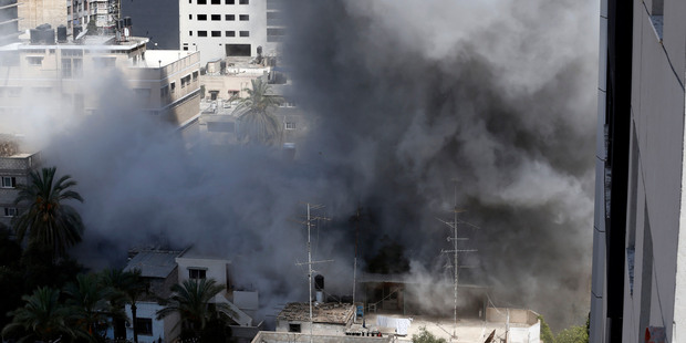 Smoke rises after an Israeli missile strike in Gaza City. Photo / AP