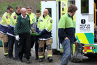 Emergency services carry one of the riders in the motorbike crash on Saturday to the ambulance. Photo/Duncan Brown Emergency services carry one of the riders in the motorbike crash on Saturday to the ambulance. Photo/Duncan Brown