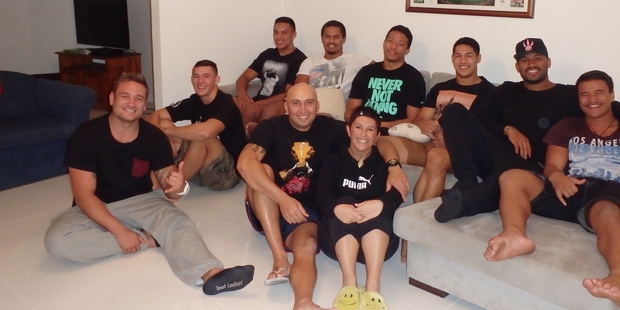 Spencer and Carmen Taplin (middle) surrounded in their Sydney home by the New Zealand Roosters contingent (from left) Jared Waerea-Hargreaves, Joseph Manu, Reuben Porter, Arthur Currie, Isaac Crichton, Roger Tuivasa-Sheck, Frank-Paul Nuuausala and Chevi Ellis.
