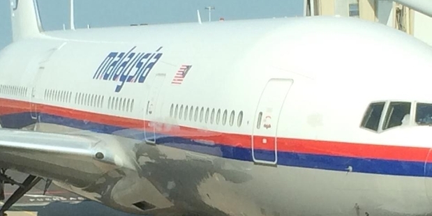 Malaysia Airlines flight MH17 photographed by passenger Cor Pan while being refuelled at Schiphol Airport, Amsterdam.