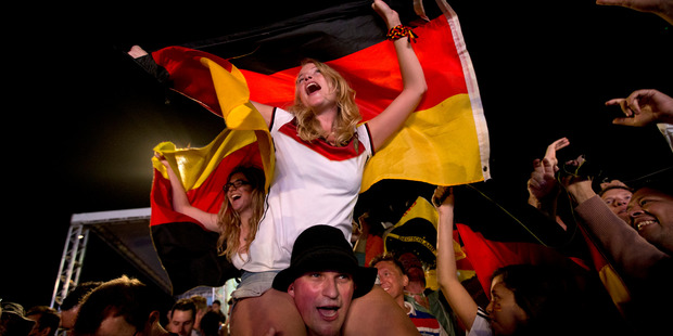 German fans on Rio's Copacabana beach celebrate their team's victory. Photo / AP