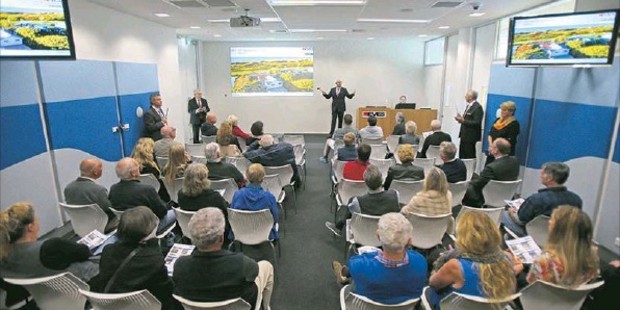 HOT PROPERTY: A shortage of properties means quality houses are attracting plenty of attention. Auctioneer Grant Child takes bids during an auction held at the Eves Bayleys auction rooms.