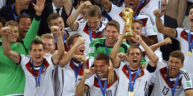 Germany's team captain Philipp Lahm lifts the World Cup trophy. Photo / AP