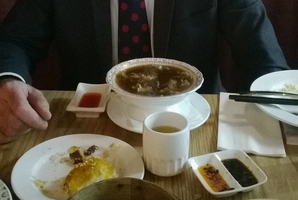 Edward Rooney with shark fin soup at the Jade Dragon restaurant.