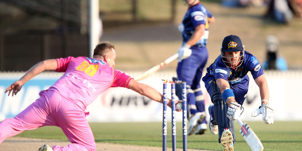 Hamish Rutherford of Otago is run out by Scott Styris of Northern Districts. Photo / Getty Images