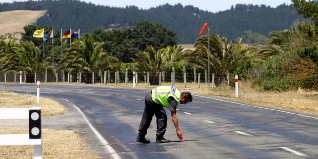 Police mark out skid marks on Clifton Rd yesterday. Photo / Paul Taylor