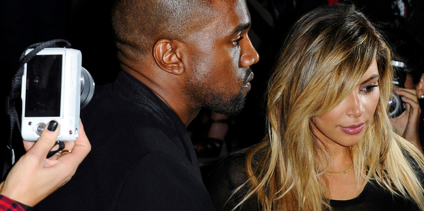 Kanye West allegedly punched an 18-year-old over a racist remark made to Kim Kardashian. Photo/AP